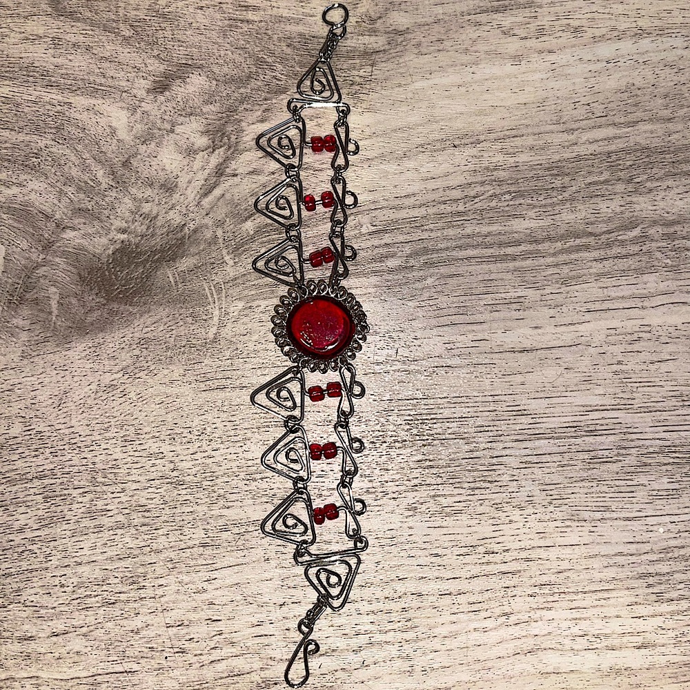 Silver bracelet with red stones